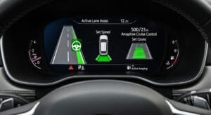 Vehicle dashboard showing lane assist and adaptive cruise control